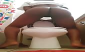 Ebony slut shitting over toilet