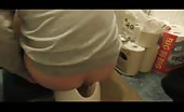Chubby guy using a potty to poop