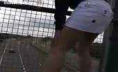 Blonde in mini skirt peeing