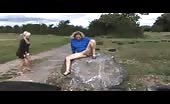 Two girls peeing together in public
