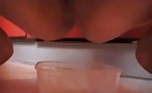 Tattooed brunette eating a scat snack