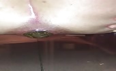 Woman shitting big green turd between her legs