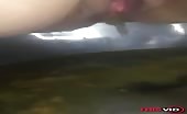 Woman shitting liquid crap into metal bowl