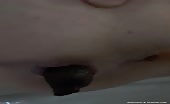 Close up of a girl pooping