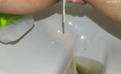Shaved wife shitting in close up