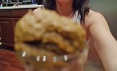 Dark haired girl smears shit on nude body