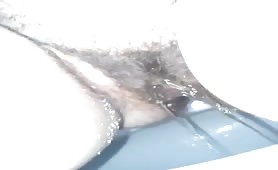 Hairy wife pooping a small brown turd