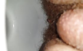 Hairy man shitting a tiny piece of poop