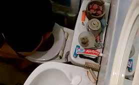 Chubby gay guy pooping in the toilet