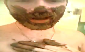 Teen boy rubbing poop on his beard