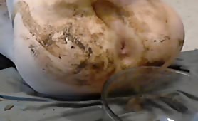 Webcam twink smearing liquid shit on his naked body