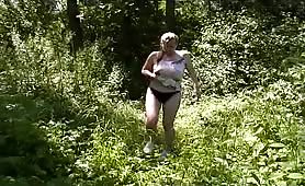 Hot blonde woman rubbing poop outdoor