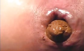 Very close up of a sexy Japanese shitting