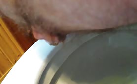 Mature man pooping a lot over the toilet
