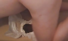 Fat woman shitting in a pair of white diapers