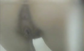 Italian woman using a public bathroom