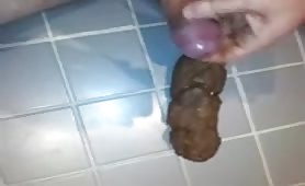 Cumshot on a long brown turd
