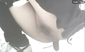 Asian girl shitting in a public bathroom