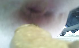 Mature man pooping in a condom