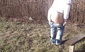 Tatooed rocker girl shitting outdoor