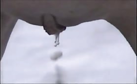 Blonde teen peeing in the snow