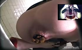 Two sexy girls pooping in a public bathroom