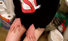 Holding his cock in his hands while shitting
