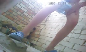 Hairy blonde peeing outdoor