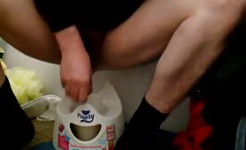 Teen boy using a white potty