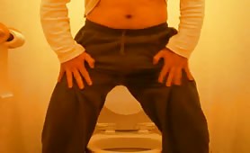 Moving his cock around while pooping in his undies