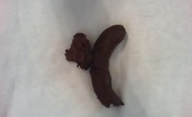Black shit on his erect cock