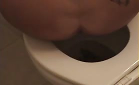 Tattooed girl shitting
