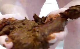 Young boy smearing brown poop