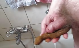 Trying to swallow a long turd