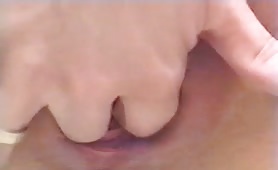 Shitting in her shaved pussy