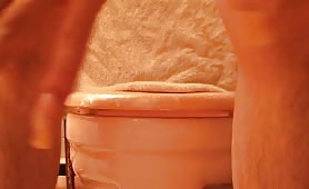 Sissy boy pooping over the toilet