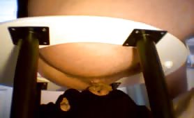 Feeding his masked slave