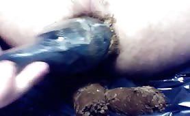 Black dildo into his asshole