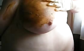 Fat granny smearing shit on her tits
