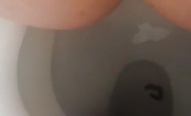 Chubby girl shitting tiny turd in toilet