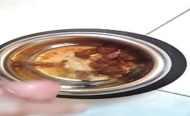 Man jerking off over a bowl of shit
