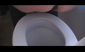 Girl shitting over the toilet bowl