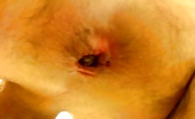 Man shitting close up, turd in his ass