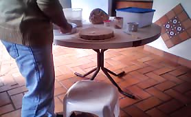 Man smears fresh shit on a white cake