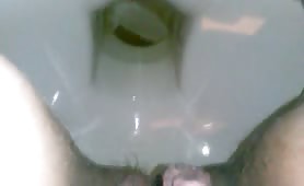 Man pissing and shitting liquid crap in toilet