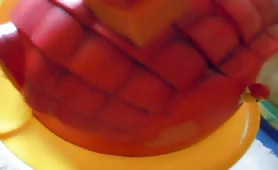 Man shitting on red toy house