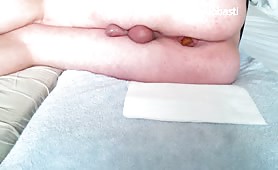 Naked man shitting on a towel in spoon position