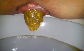Man shits long yellow turd into dirty toilet