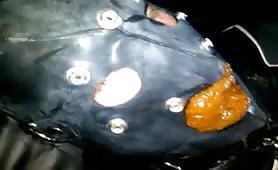 Gay slave shitting on black leather with turd on chest