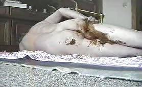 Mature man smearing fresh crap all over his body